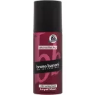 Bruno Banani Loyal Man 150ml-es férfi dezodor spray jellegzetes dőlt mélyvörös flakonja fekete kupakkal, fekete bruno banani felirattal és 24Hr Lasting Scent jelzéssel.