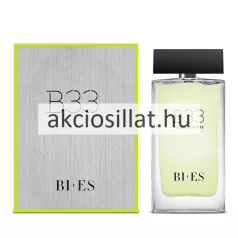 A Bi-Es B33 EDT 90ml - Hermes H 24 parfüm utánzat.jpg képen a férfi parfüm szögletes, átlátszó üvegflakonja látható halványzöld folyadékkal és fekete kupakkal, a fahatású szürke gyári doboza mellett.