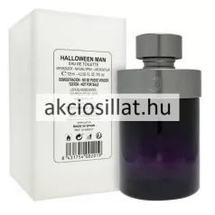 A Jesus Del Pozo Halloween Man EDT 125ml TESZTER.jpg fotón a mélylila színű hengeres üvegflakon látható gunmetal szürke színű kupakkal és gallérral, mellette a letisztult fehér színű gyári teszter dobozával, amelyen termékinformációk és egy vonalkód szerepelnek.