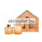 Sence Gingerbread House lakásillatosító ajándékcsomag mézeskalács házikó alakú doboza, mellette az üvegedényes illatgyertya és az arany kupakos pálcikás diffúzor.